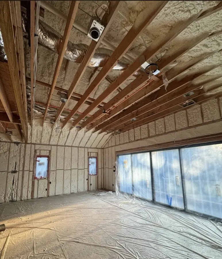 Interior walls and ceiling insulated with spray foam during new construction in Brownsburg